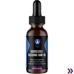 Close-up of Goddesses Blessing Hair Oil bottle detailing claims for repairing hair and stimulating growth